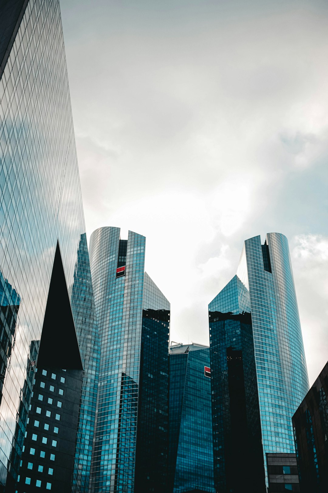a-group-of-tall-buildings-sitting-next-to-each-other-yv9xkmqw0nm
